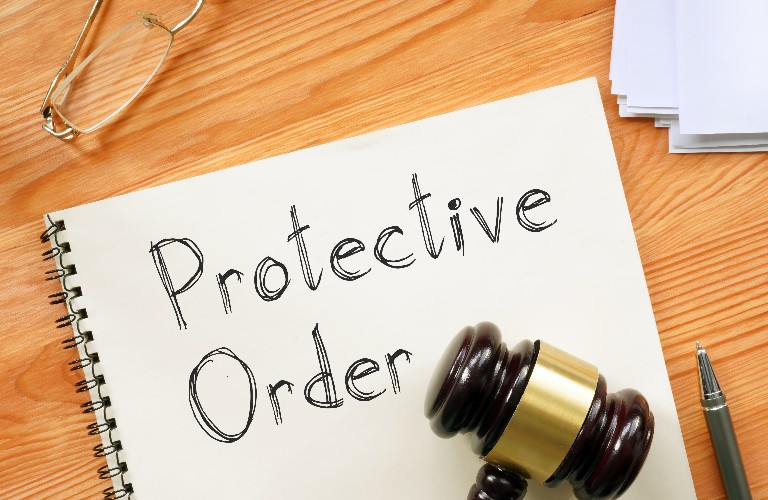Protective Order is shown on a photo using the text