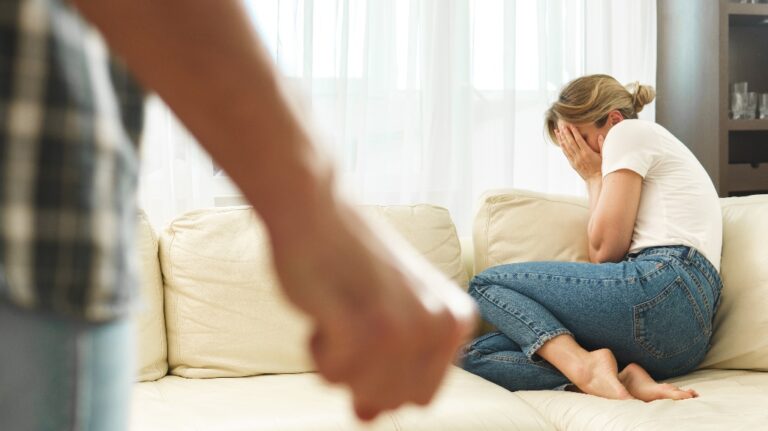 Scared woman victim of domestic violence attacked by her aggressive partner