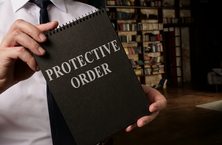 lawyer is showing protective order book